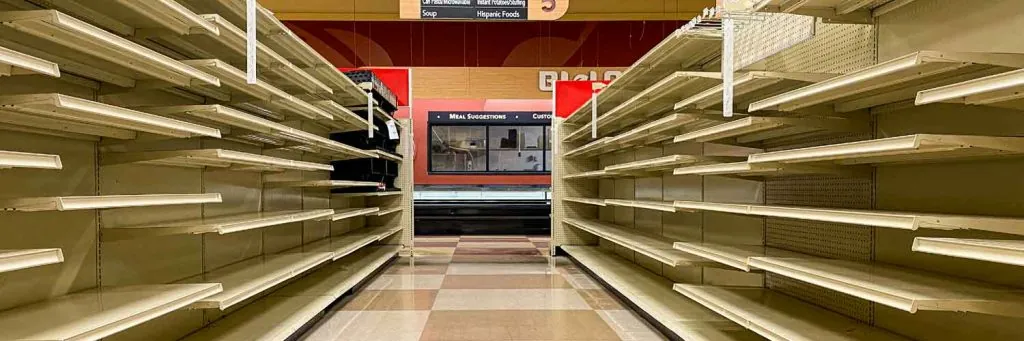 Empty Grocery Store Aisle With No Products Available After Sell Out