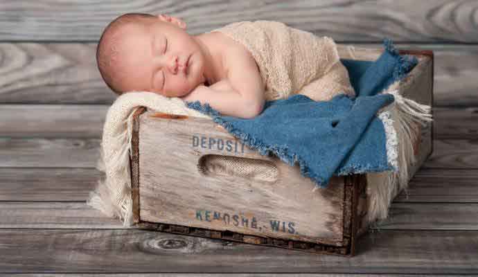 Baby in crate