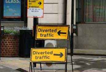 diverted traffic signage in opposite directions