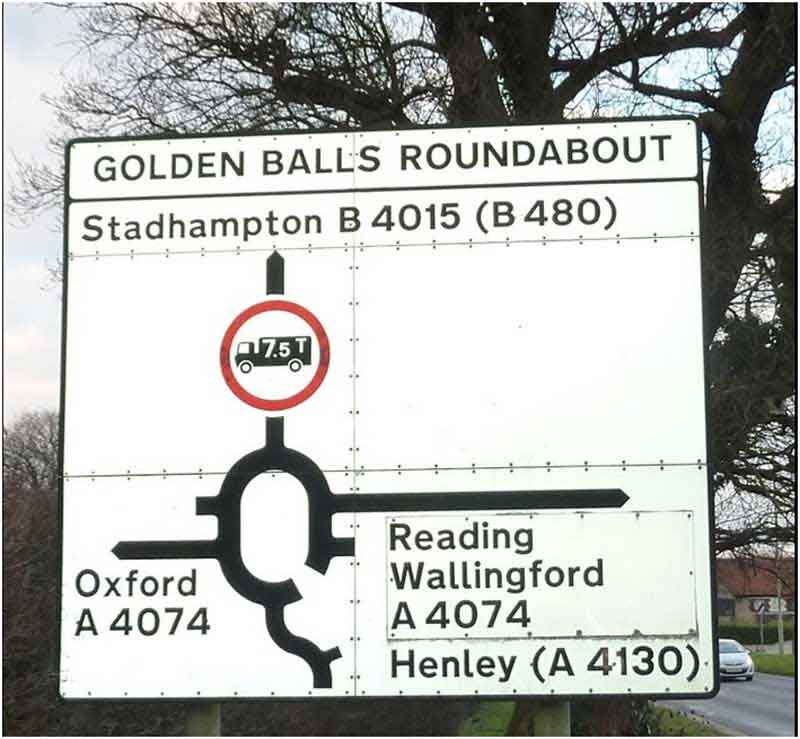 golden balls roundabout sign