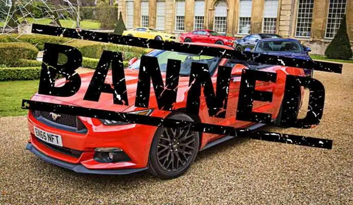 BANNED text over red sports car