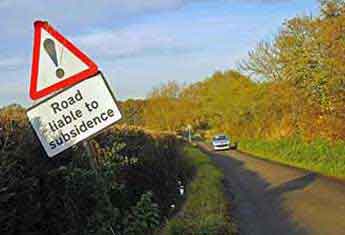 road liable to subsidence sign subsided