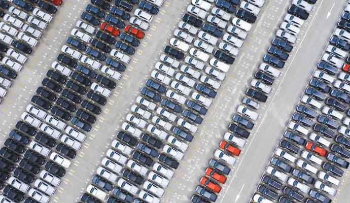 aerial view rows of new cars