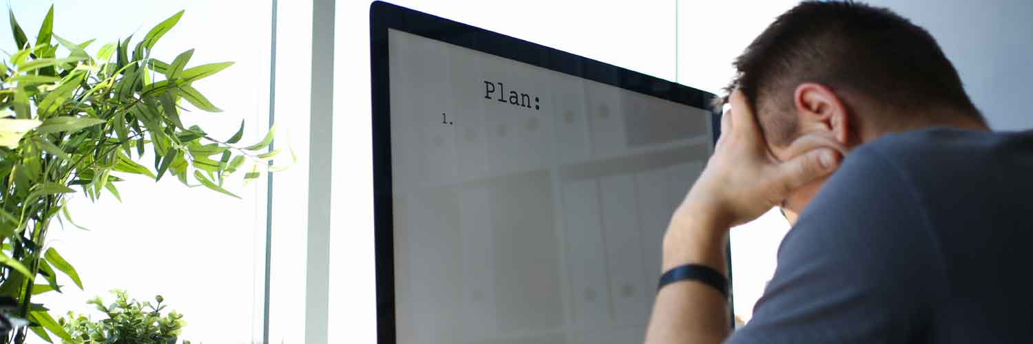 man with hands in head blank plan on screen
