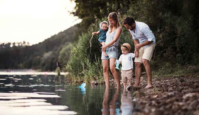 family by water