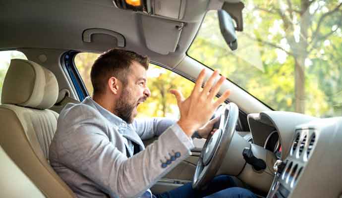 angry driver behind the steering wheel but not one from the couriers near me