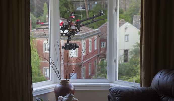  a courier services near me? A drone with a camera hovering outside living-room window