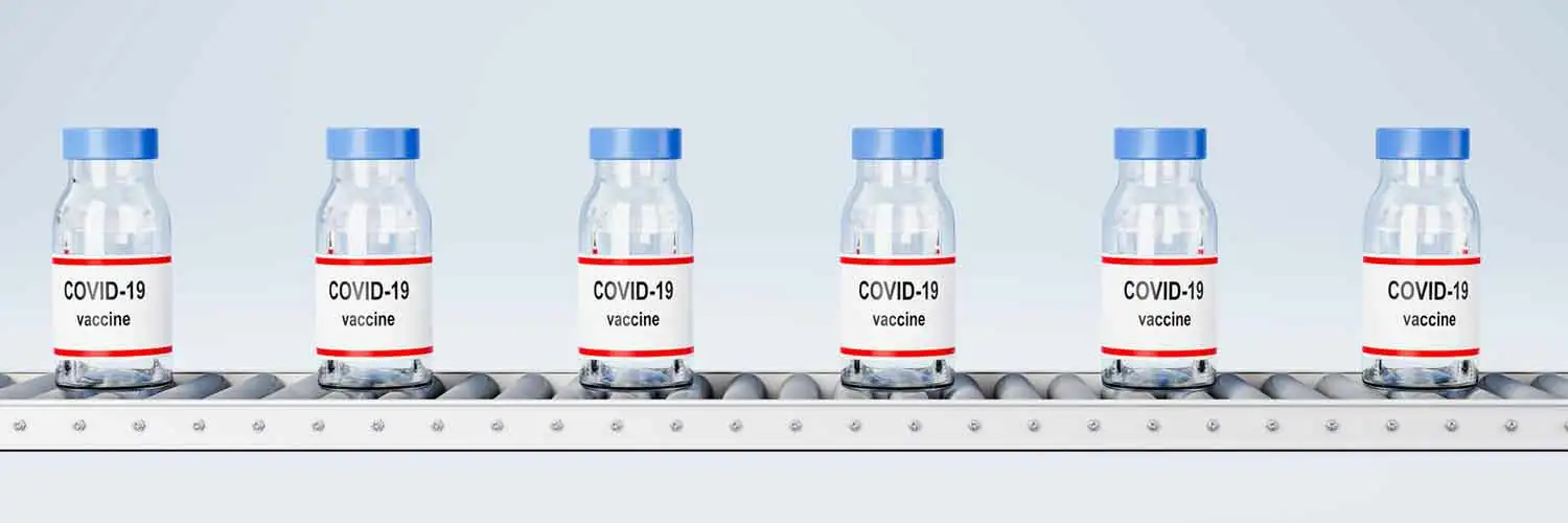 vaccine bottles on conveyor