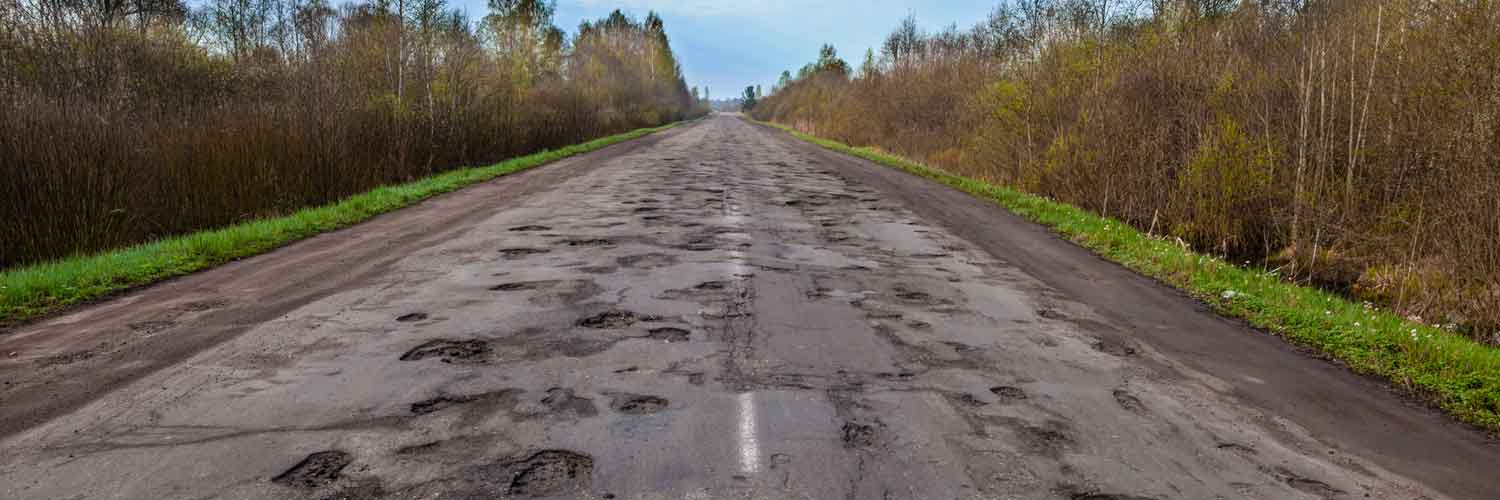 Same day courier companies navigating potholes on rural road