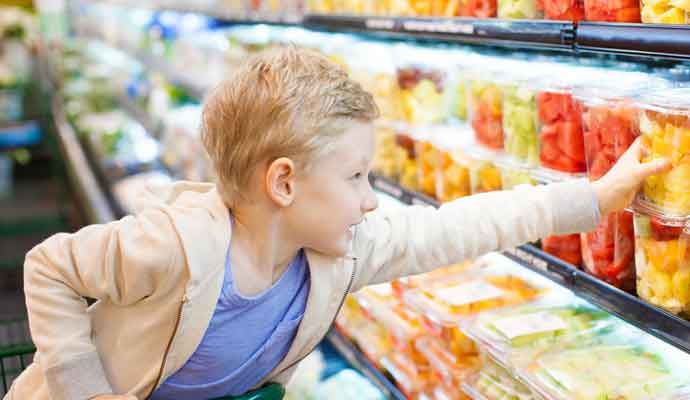 child at foodstore serviced by mega warehouses